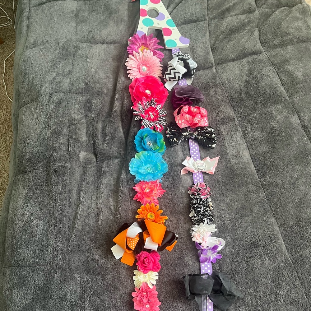 Hair bows & flowers with a hanging “A” bow holder with ribbons